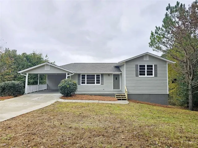 a front view of a house with yard