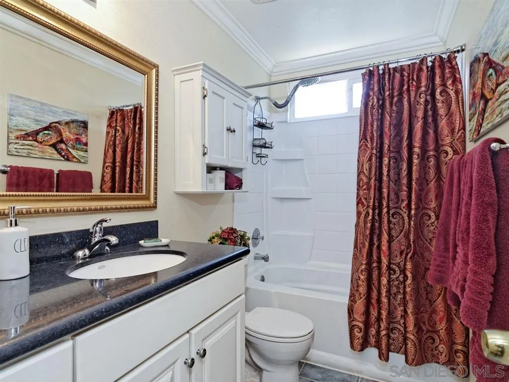 1718 West Knapp Drive Vista, CA 92083 - Photo 12 of 24 a bathroom with a sink toilet and shower