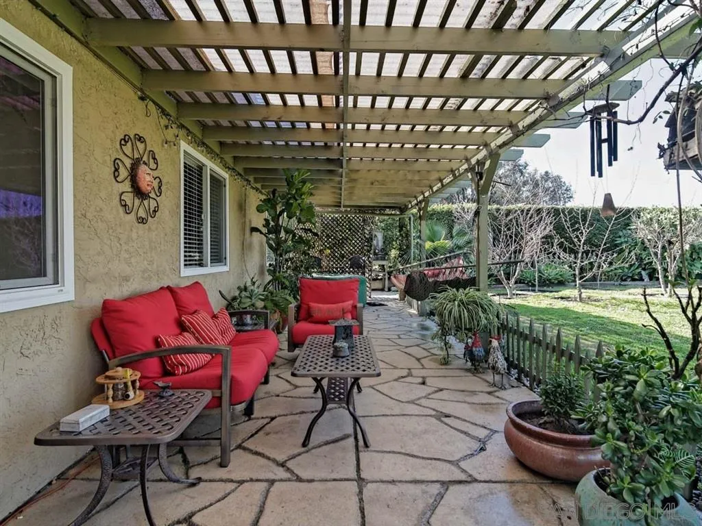 1718 West Knapp Drive Vista, CA 92083 - Photo 17 of 24 a view of a porch with furniture and a yard