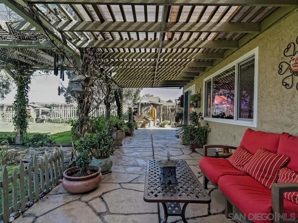 1718 West Knapp Drive Vista, CA 92083 - Photo 18 of 24 a outdoor living space with furniture and a potted plant