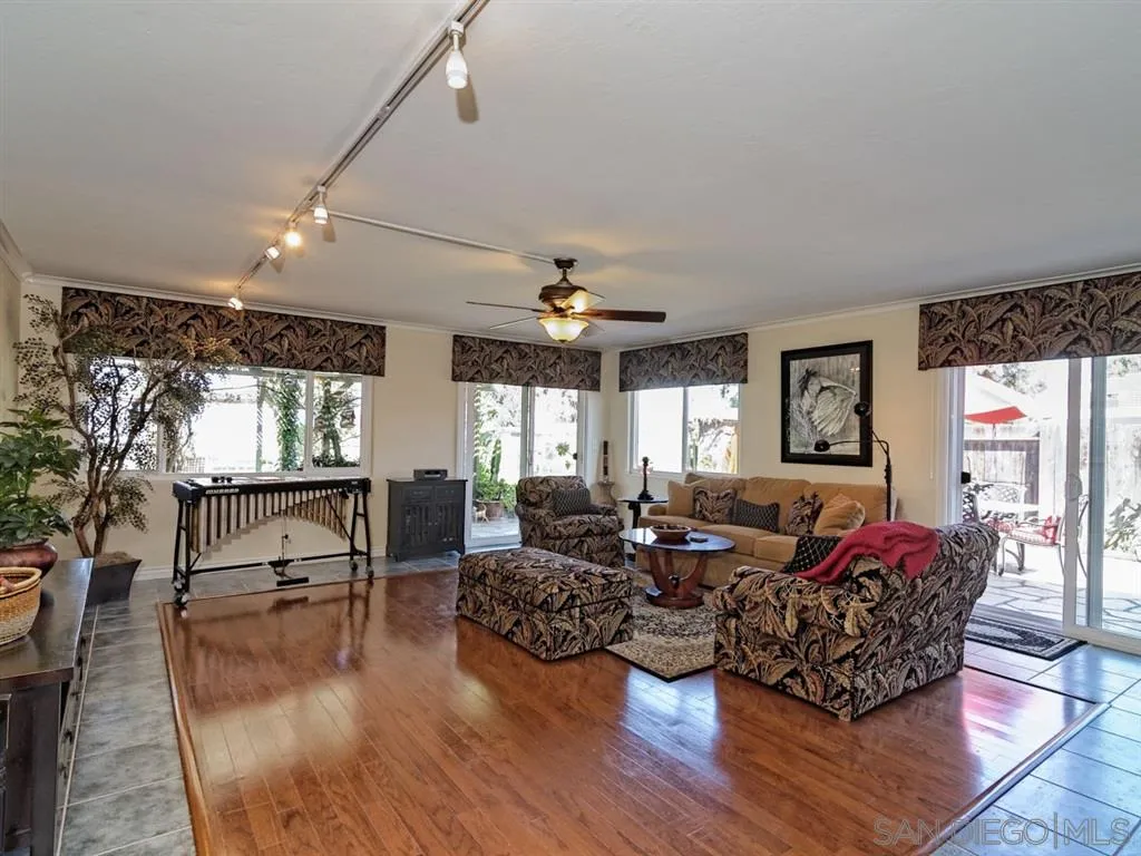 1718 West Knapp Drive Vista, CA 92083 - Photo 24 of 24 a living room with furniture window and wooden floor