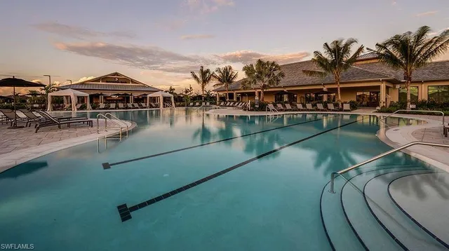 an aerial view of residential house with outdoor space and swimming pool