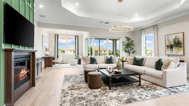 a living room with fireplace furniture and a flat screen tv