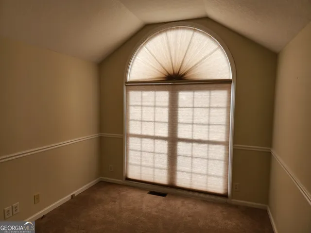 a bathroom with a sink vanity mirror and toilet