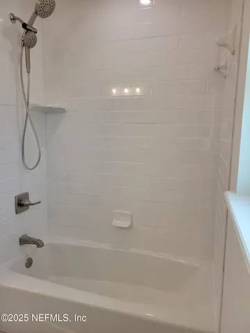 a close view of a bathtub in a bathroom