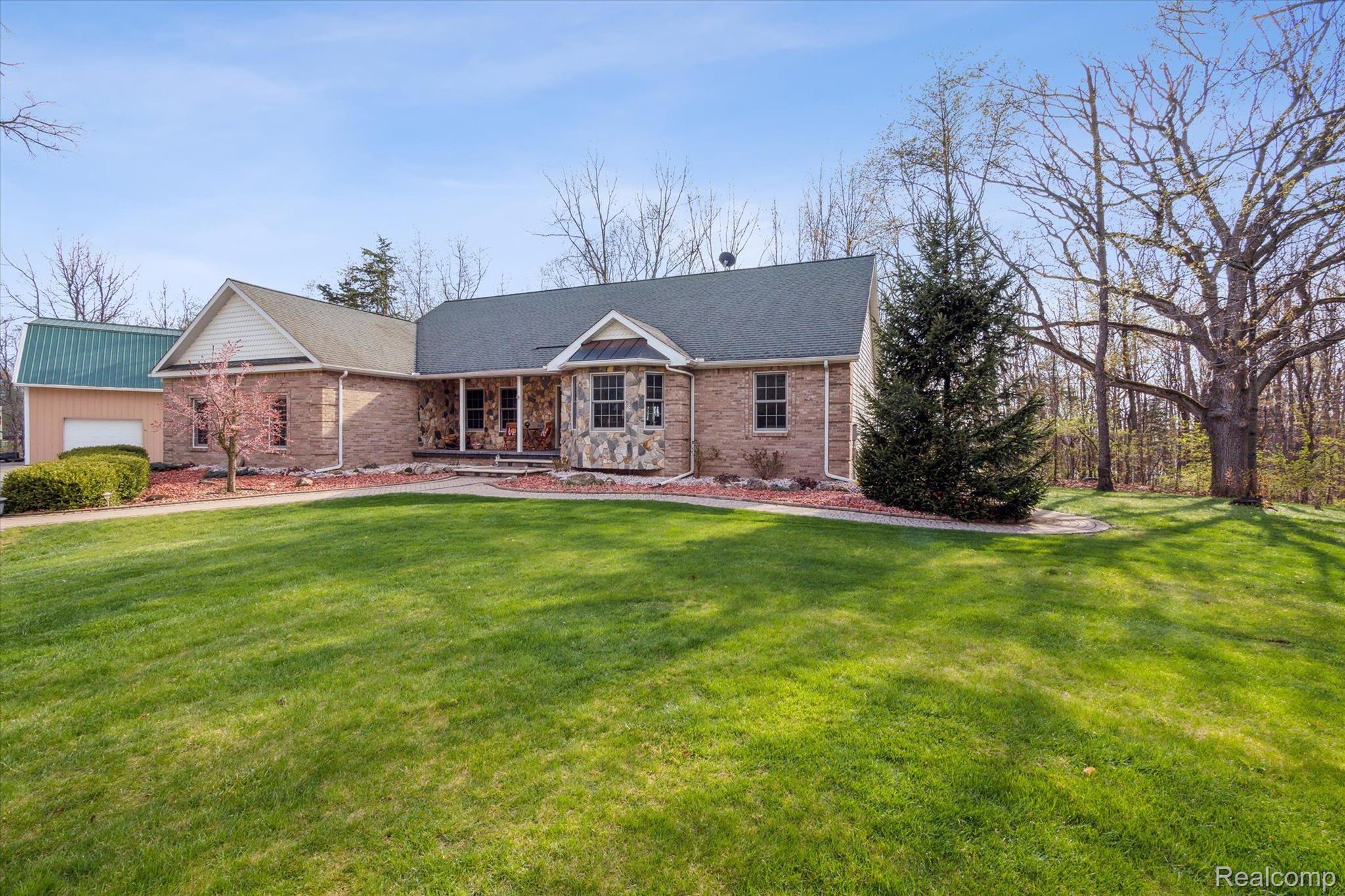 2659 West Coon Lake Road Howell, MI 48843 - Photo 2 of 45 Professional landscaping