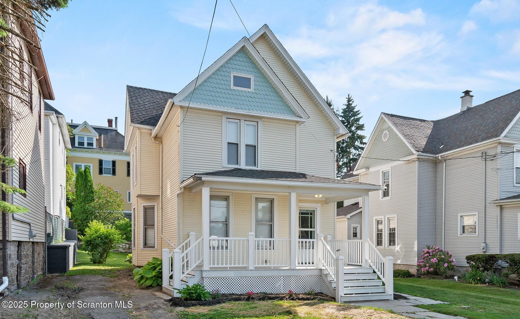 724 Electric Street Scranton, PA 18509 - Photo 1 of 17 a front view of a house with garden