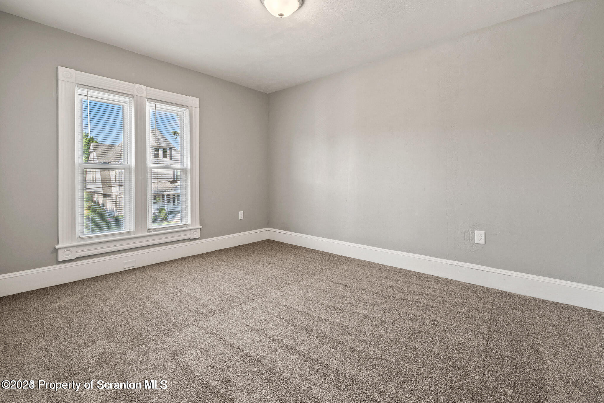 724 Electric Street Scranton, PA 18509 - Photo 16 of 17 an empty room with a window