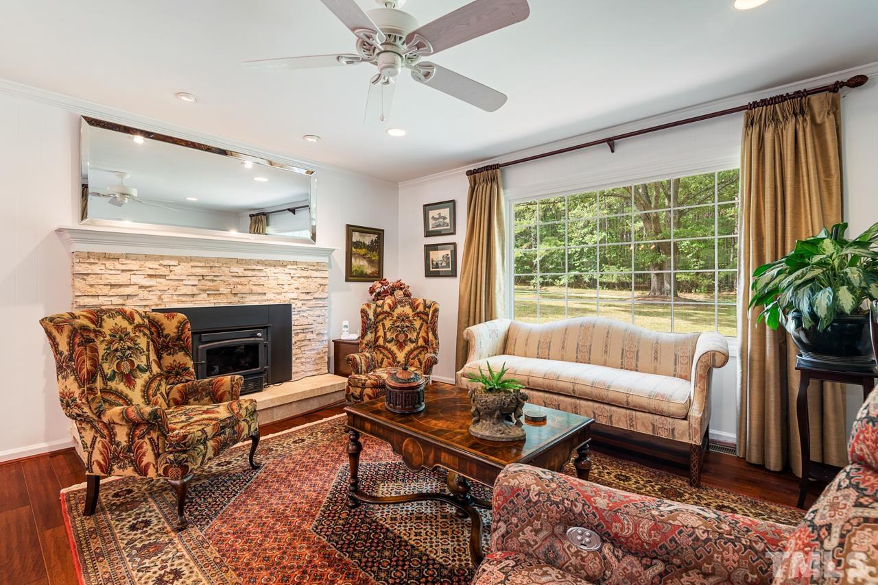 7612 Jock Road Bahama, NC 27503 - Photo 13 of 53 a living room with furniture and a fireplace