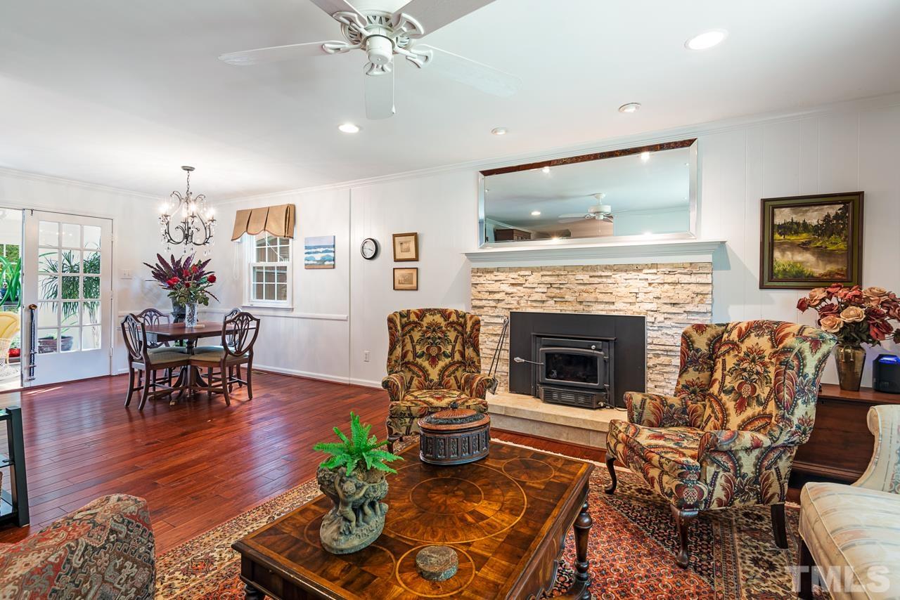 7612 Jock Road Bahama, NC 27503 - Photo 14 of 53 a living room with furniture and a fireplace