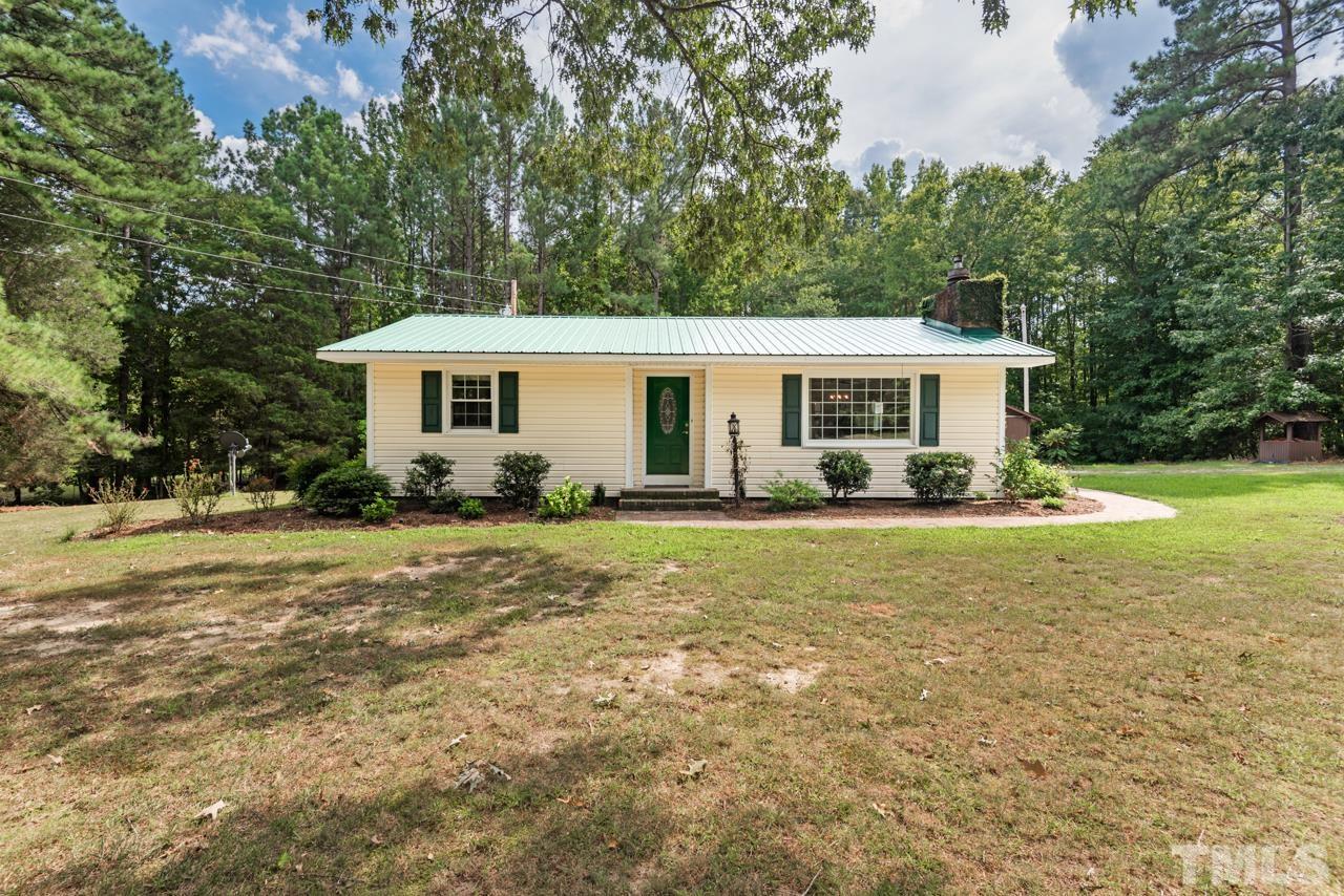 7612 Jock Road Bahama, NC 27503 - Photo 2 of 53 a view of a house with backyard and sitting area