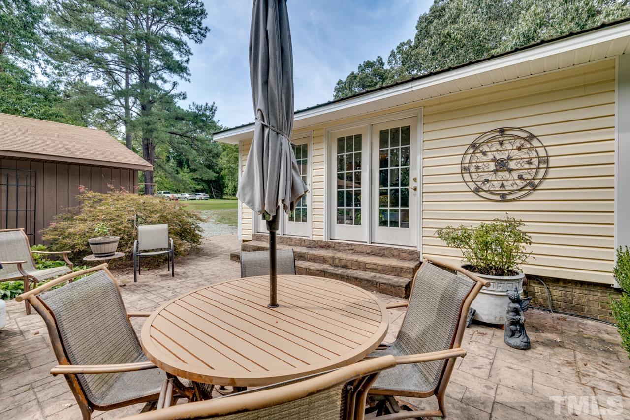 7612 Jock Road Bahama, NC 27503 - Photo 27 of 53 a view of a patio with couple of chairs