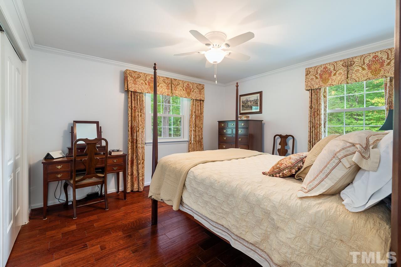 7612 Jock Road Bahama, NC 27503 - Photo 30 of 53 a bedroom with a bed and a large window