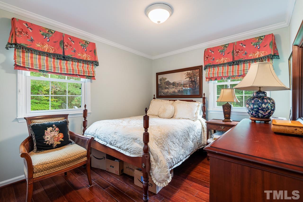 7612 Jock Road Bahama, NC 27503 - Photo 33 of 53 a bedroom with a bed and a window