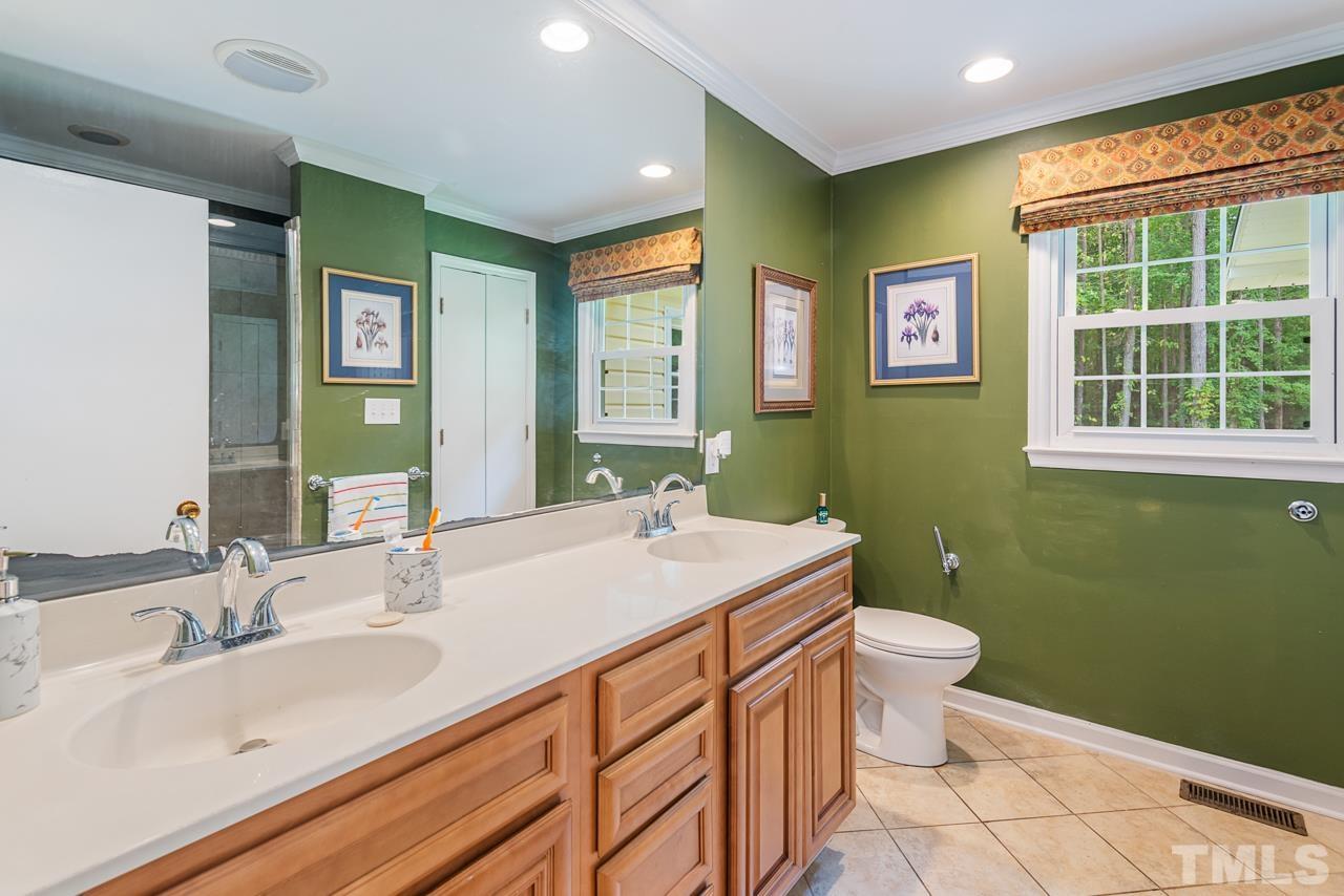 7612 Jock Road Bahama, NC 27503 - Photo 34 of 53 a bathroom with a sink toilet and a mirror