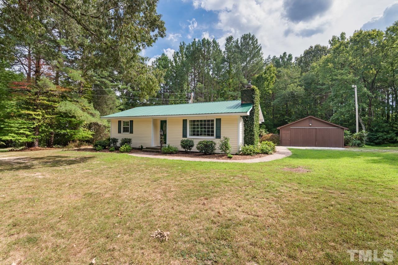 7612 Jock Road Bahama, NC 27503 - Photo 4 of 53 a view of a house with a backyard and a tree