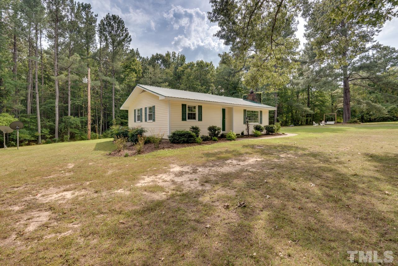 7612 Jock Road Bahama, NC 27503 - Photo 43 of 53 a view of a house with yard and sitting area