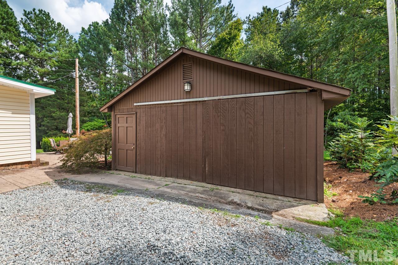 7612 Jock Road Bahama, NC 27503 - Photo 44 of 53 a wooden house with a outdoor space