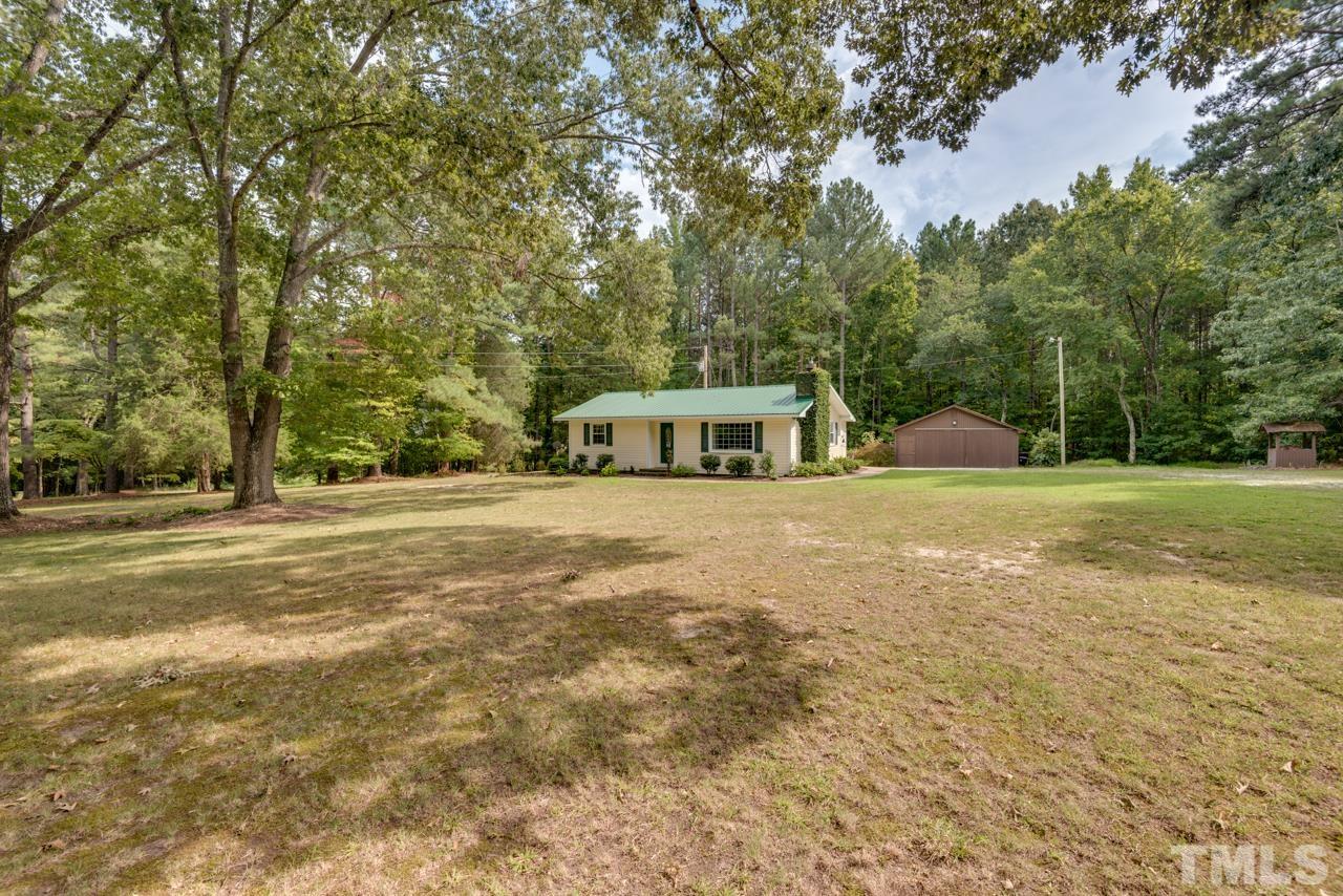 7612 Jock Road Bahama, NC 27503 - Photo 5 of 53 a house view with a outdoor space