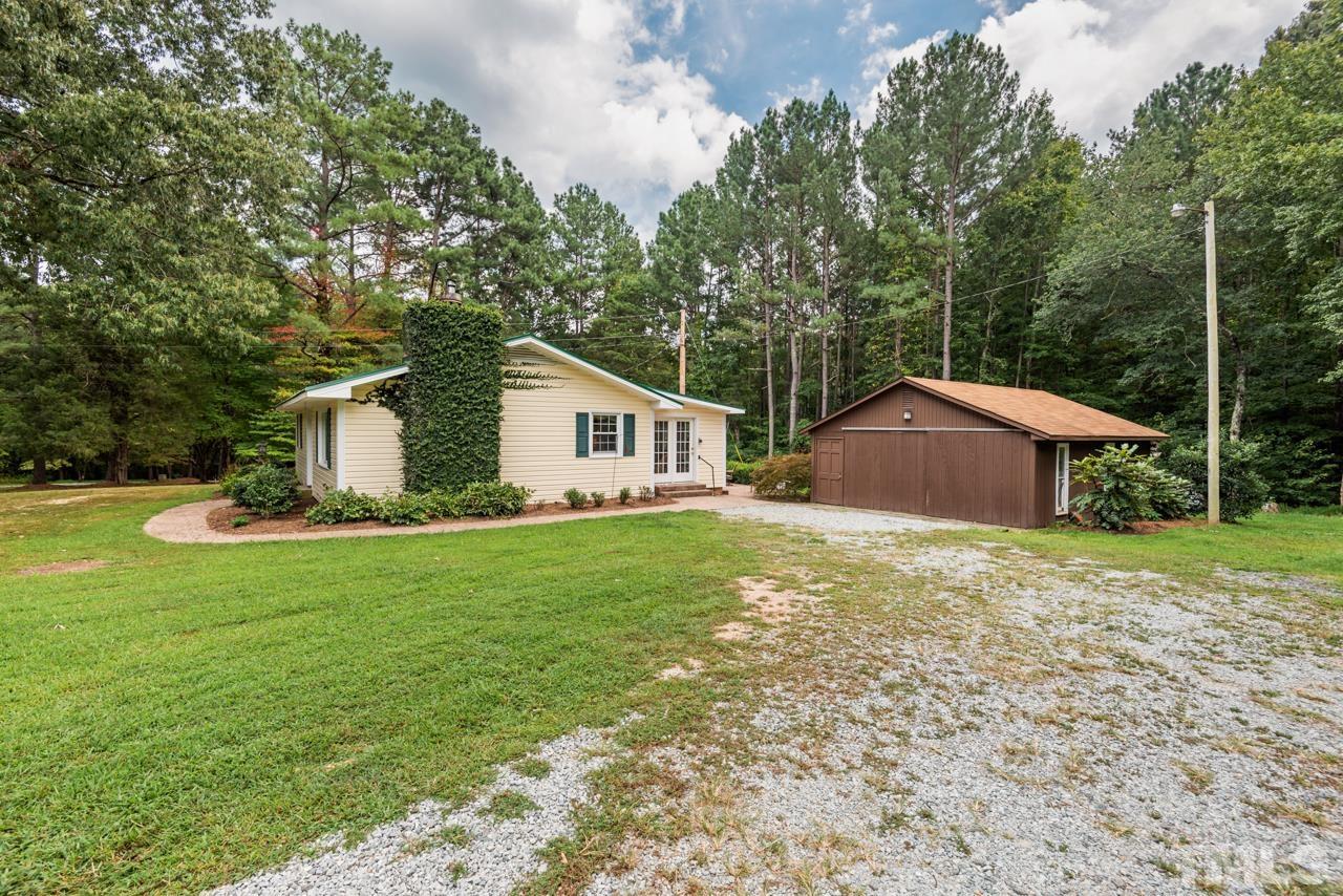 7612 Jock Road Bahama, NC 27503 - Photo 6 of 53 a house view with a garden space