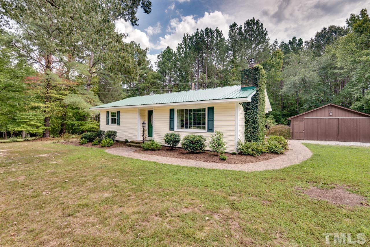 7612 Jock Road Bahama, NC 27503 - Photo 7 of 53 a front view of house with yard and green space