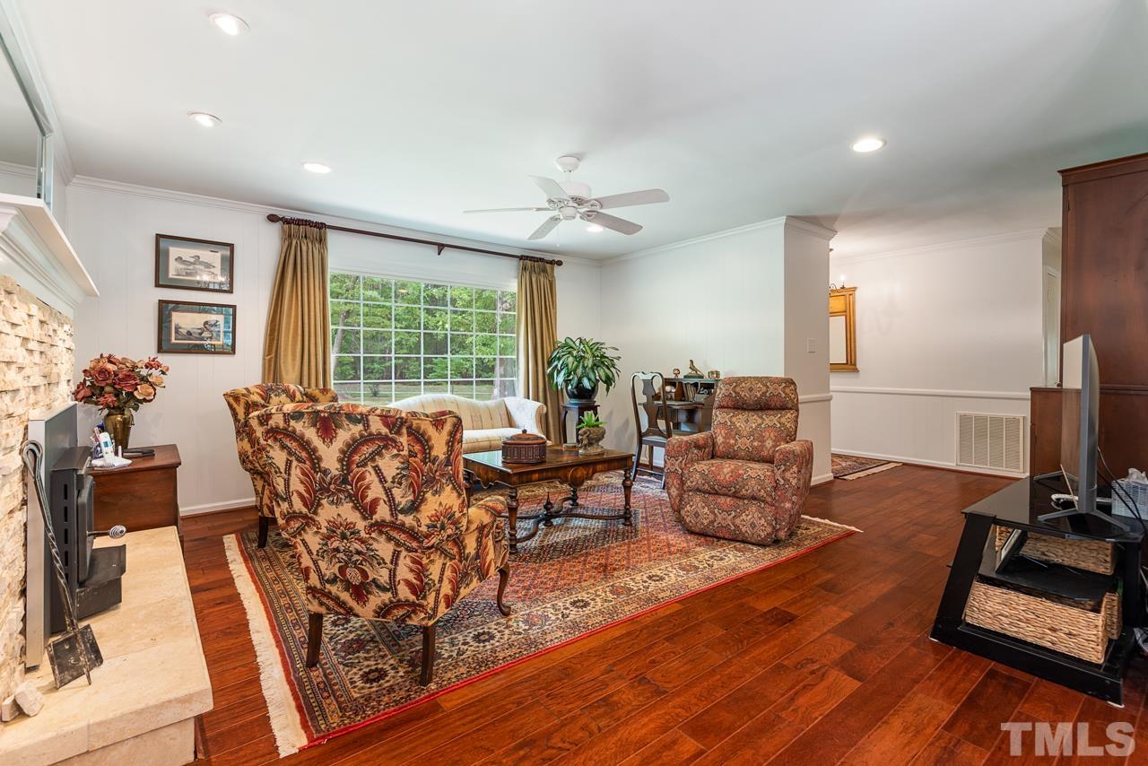 7612 Jock Road Bahama, NC 27503 - Photo 10 of 53 a living room with furniture a large window and wooden floor