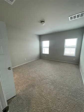 a bathroom with a double vanity sink and mirror