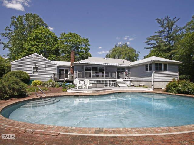9 Barncroft Road Stamford, CT 06902 - Photo 1 of 1 a front view of house with yard and seating area