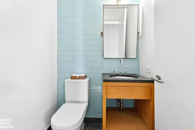 a dining room with furniture window and wooden floor