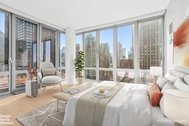 a bathroom with a toilet a sink and a mirror