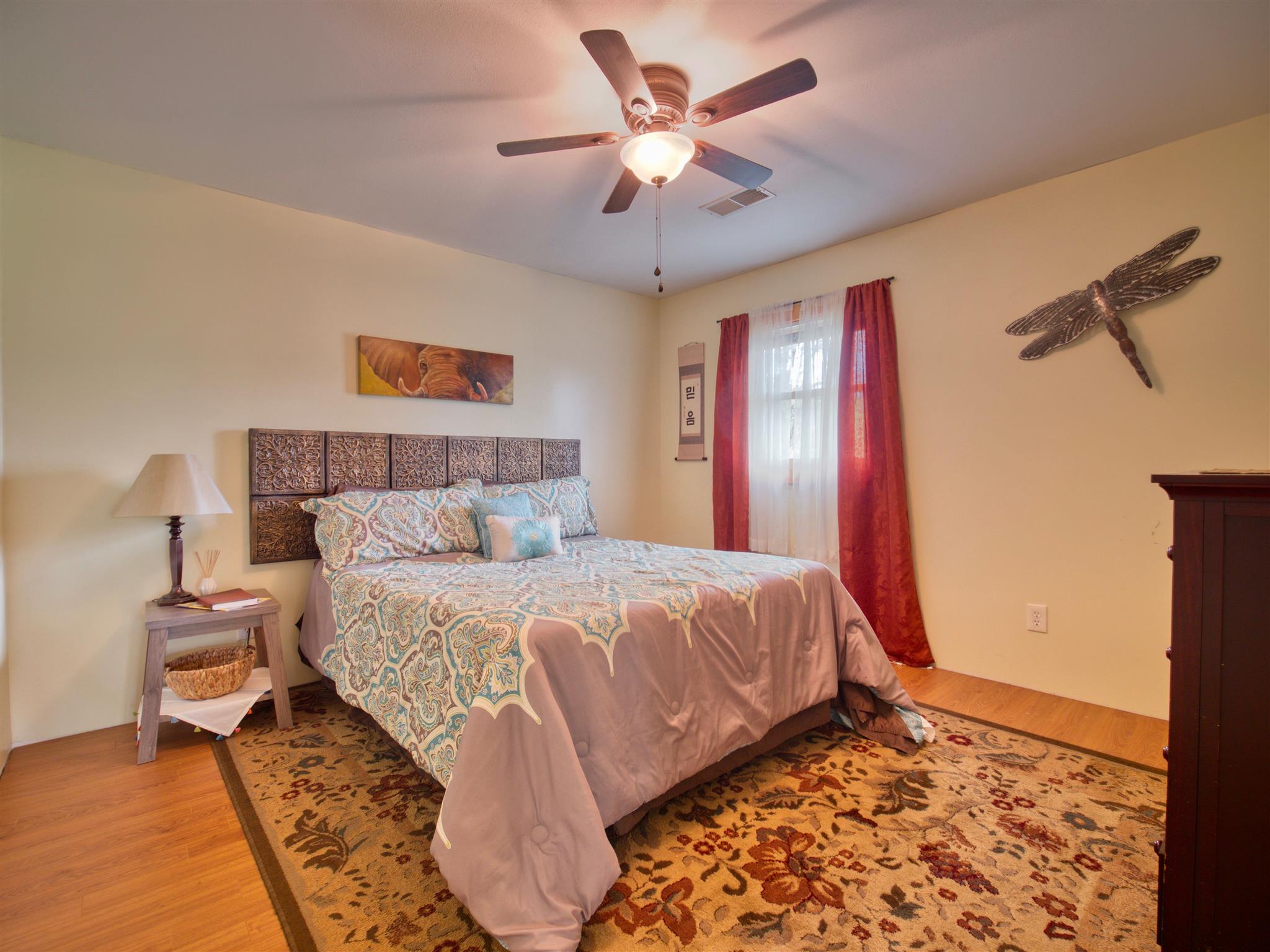 328 Charles Smith Road Lascassas, TN 37085 - Photo 19 of 26 a bedroom with a bed and a chandelier