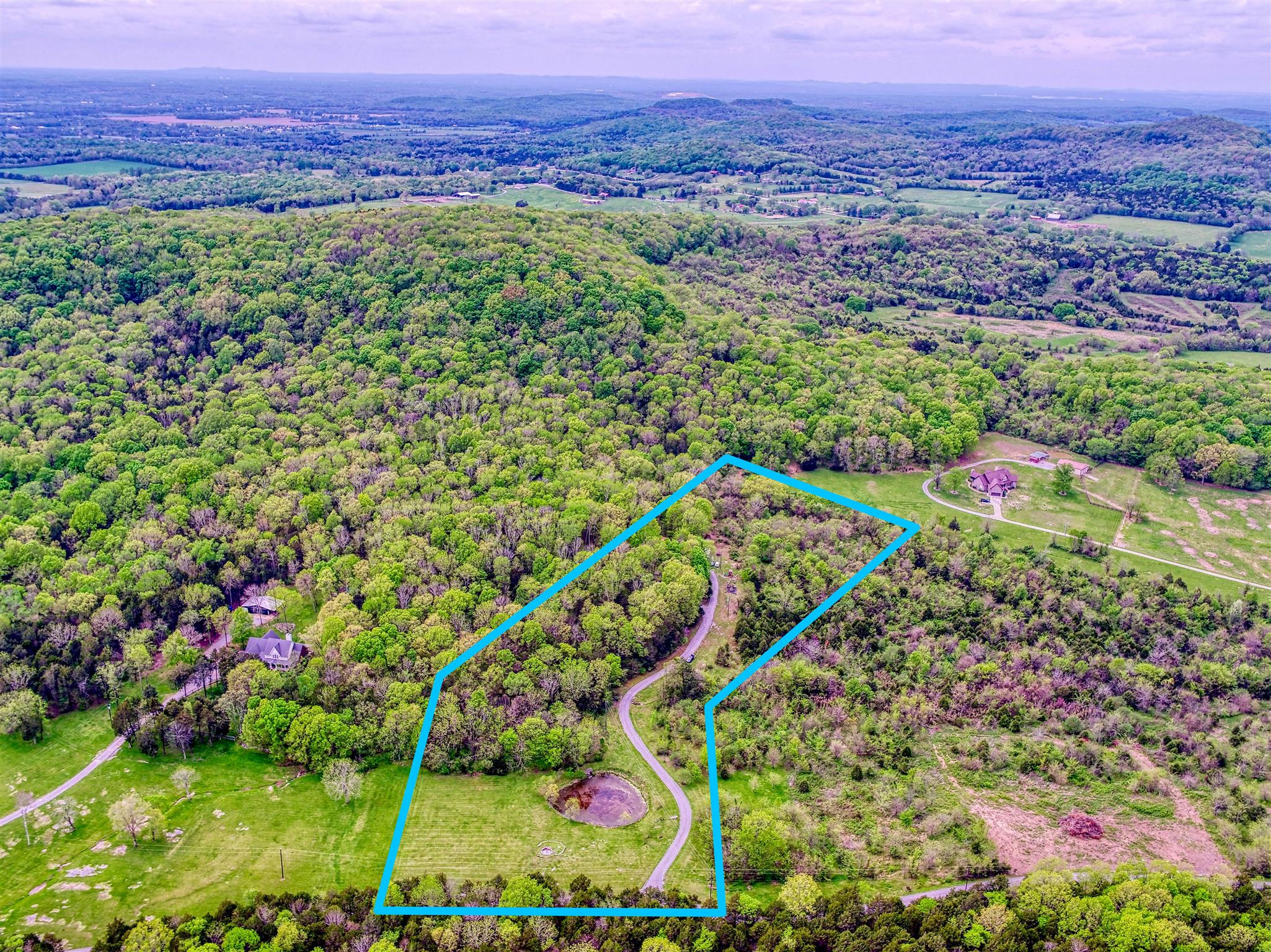 328 Charles Smith Road Lascassas, TN 37085 - Photo 20 of 26 a view of a area with a lush green forest
