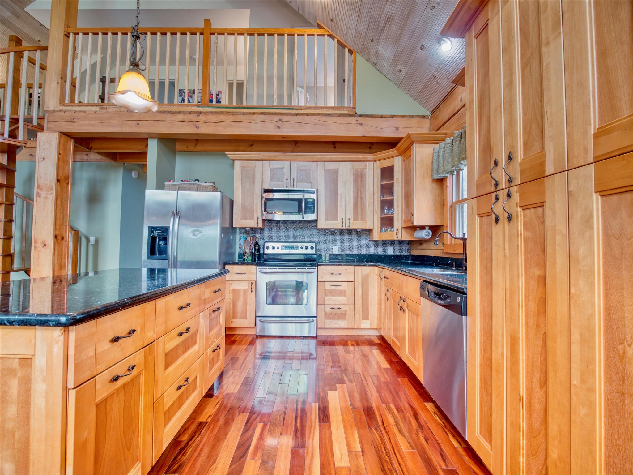 328 Charles Smith Road Lascassas, TN 37085 - Photo 5 of 26 a kitchen with granite countertop stainless steel appliances and wooden cabinets