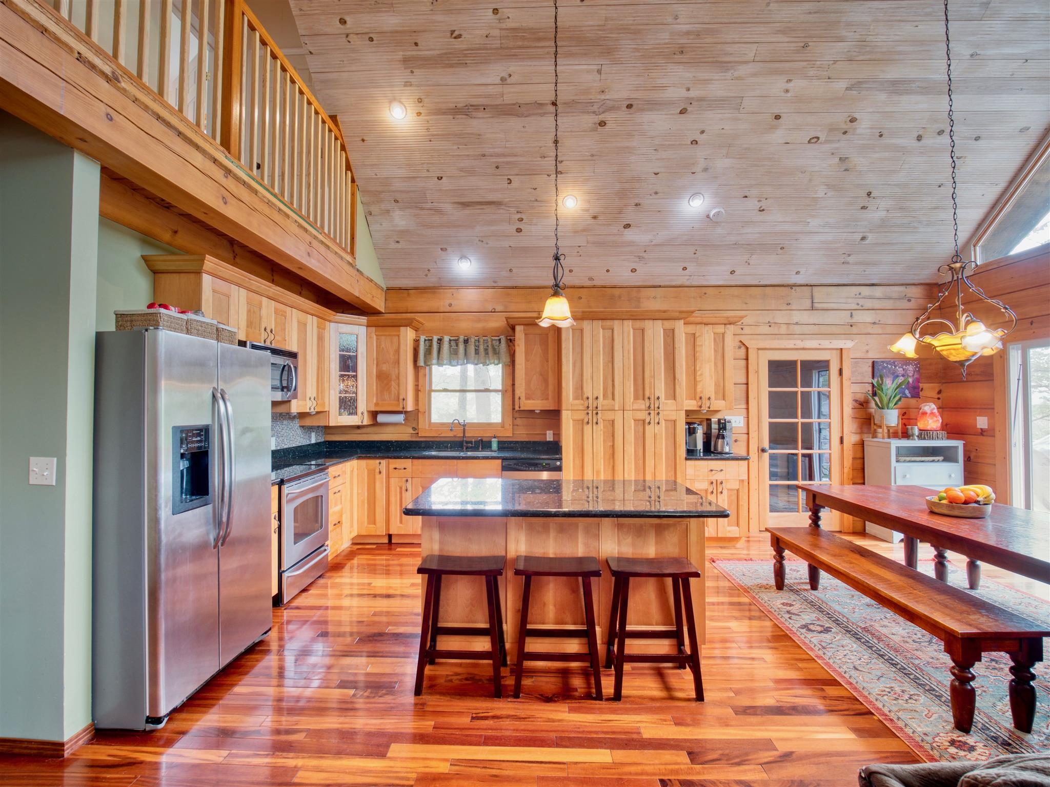 328 Charles Smith Road Lascassas, TN 37085 - Photo 7 of 26 a room with stainless steel appliances kitchen island granite countertop furniture and a kitchen view