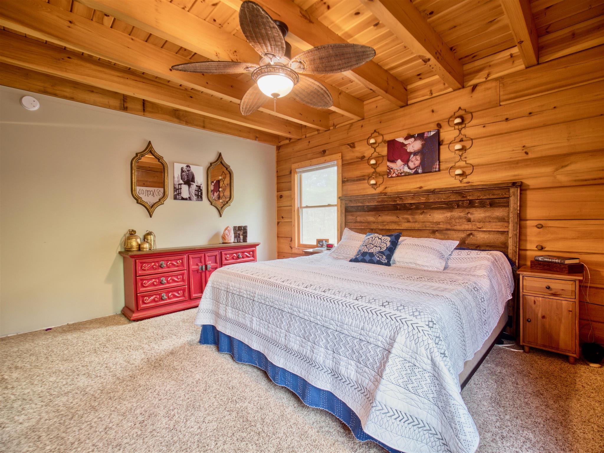 328 Charles Smith Road Lascassas, TN 37085 - Photo 9 of 26 a bedroom with a bed and a wall painting