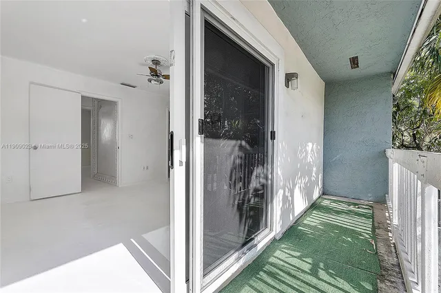 a view of a hallway and interior of the house