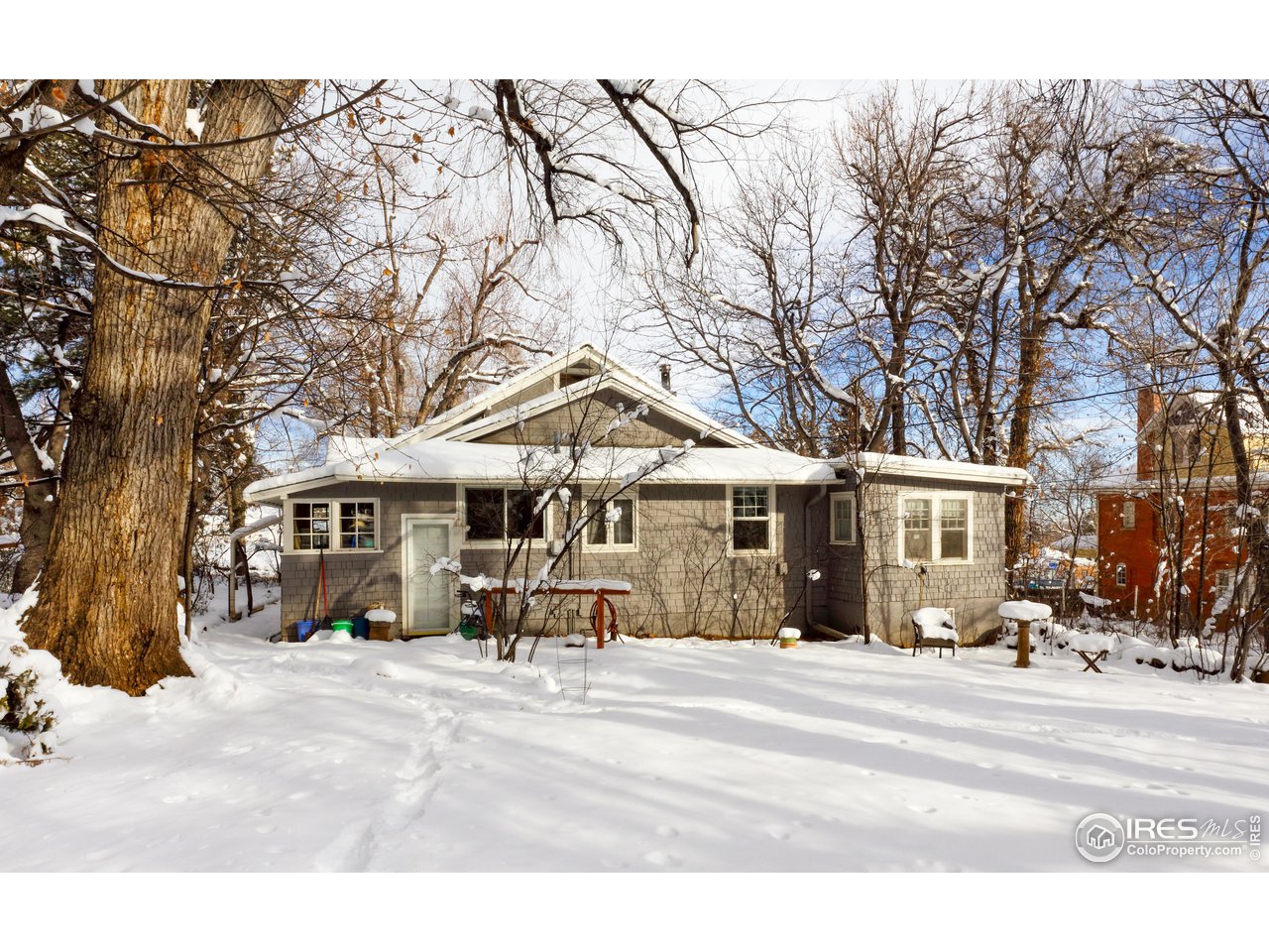 1520 Baseline Road Boulder, CO 80302 - Photo 11 of 29 a front view of a house with a tree in front