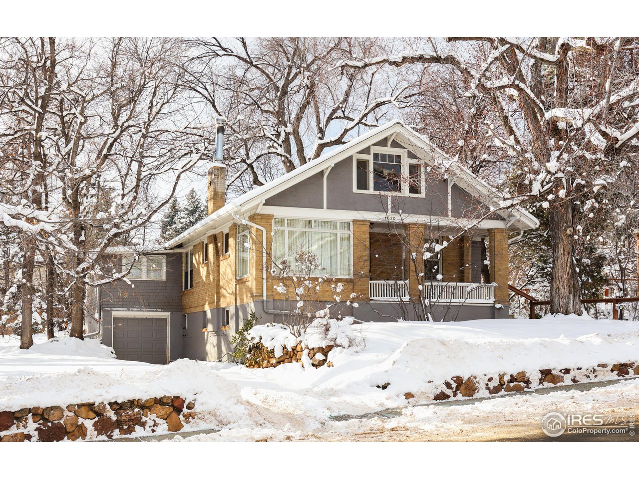 1520 Baseline Road Boulder, CO 80302 - Photo 2 of 29 a front view of a house with a yard covered in snow