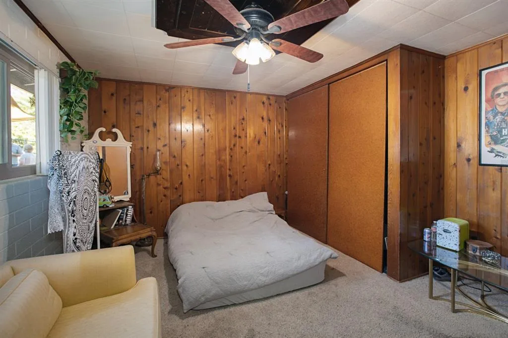 1247 Marshall Road Alpine, CA 91901 - Photo 12 of 20 a bedroom with a bed and a chandelier