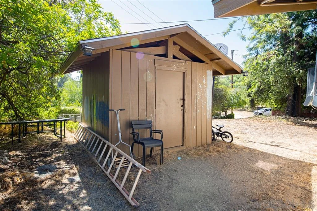 1247 Marshall Road Alpine, CA 91901 - Photo 19 of 20 a view of wooden house with a small yard and wooden fence