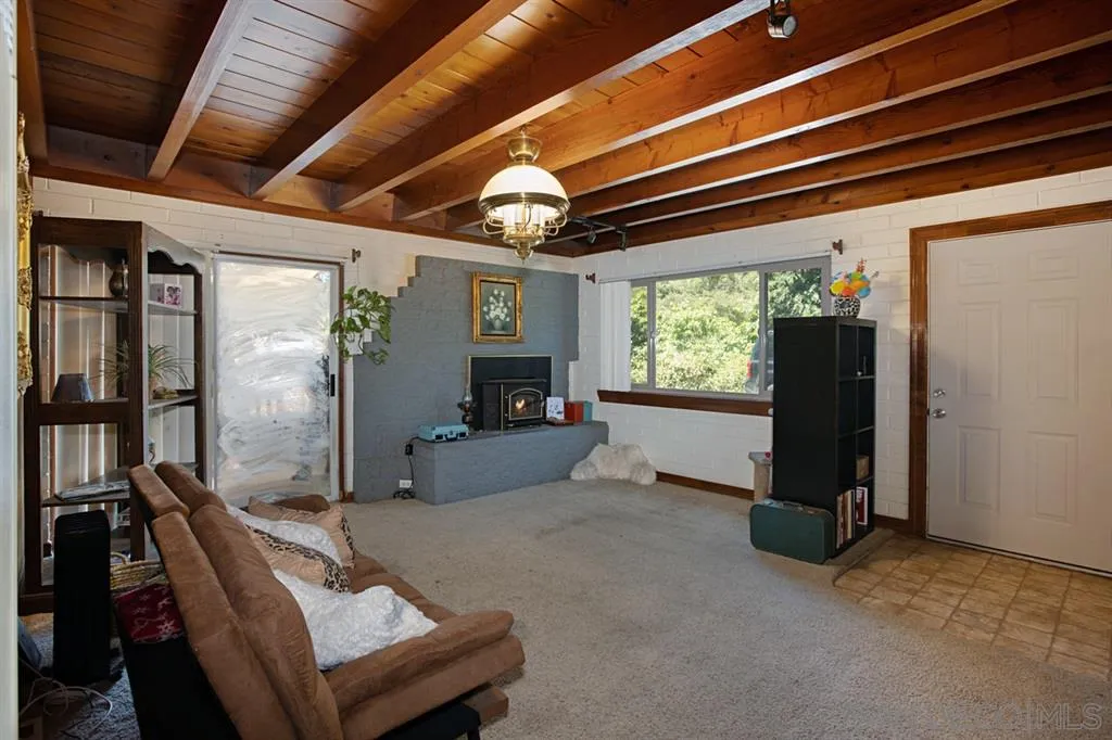 1247 Marshall Road Alpine, CA 91901 - Photo 3 of 20 a view of a livingroom with furniture and a floor to ceiling window