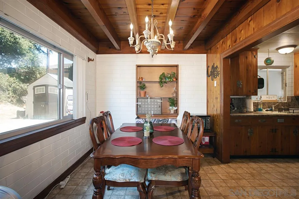 1247 Marshall Road Alpine, CA 91901 - Photo 7 of 20 a dining room with furniture a chandelier and window