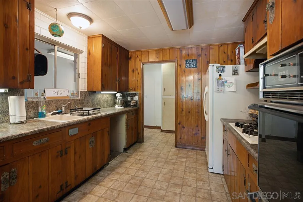 1247 Marshall Road Alpine, CA 91901 - Photo 9 of 20 a large kitchen with stainless steel appliances granite countertop a refrigerator and a stove