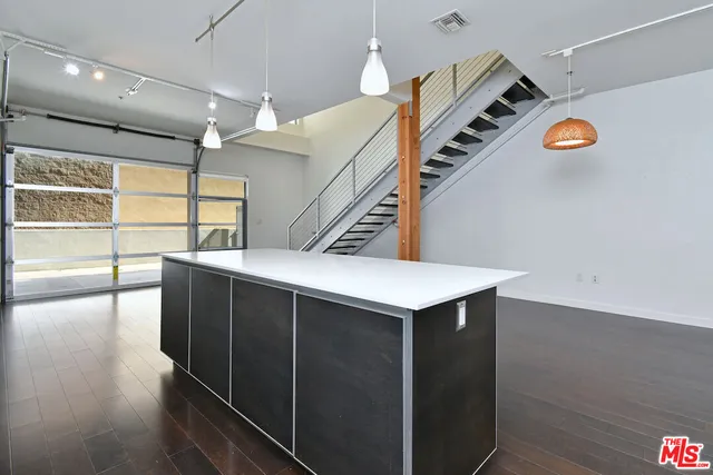 a view of entryway and kitchen