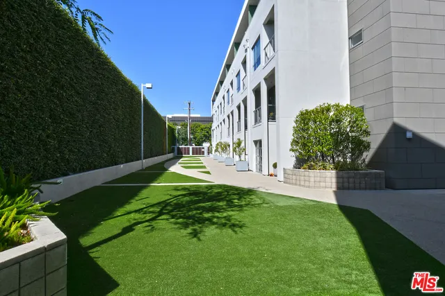a balcony with lots of green space