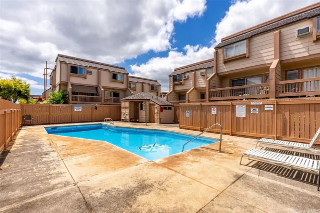 a view of a house with swimming pool