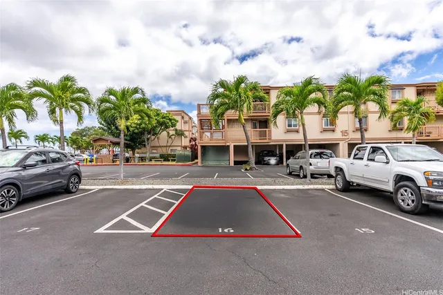 a view of multiple houses with swimming pool and sitting area