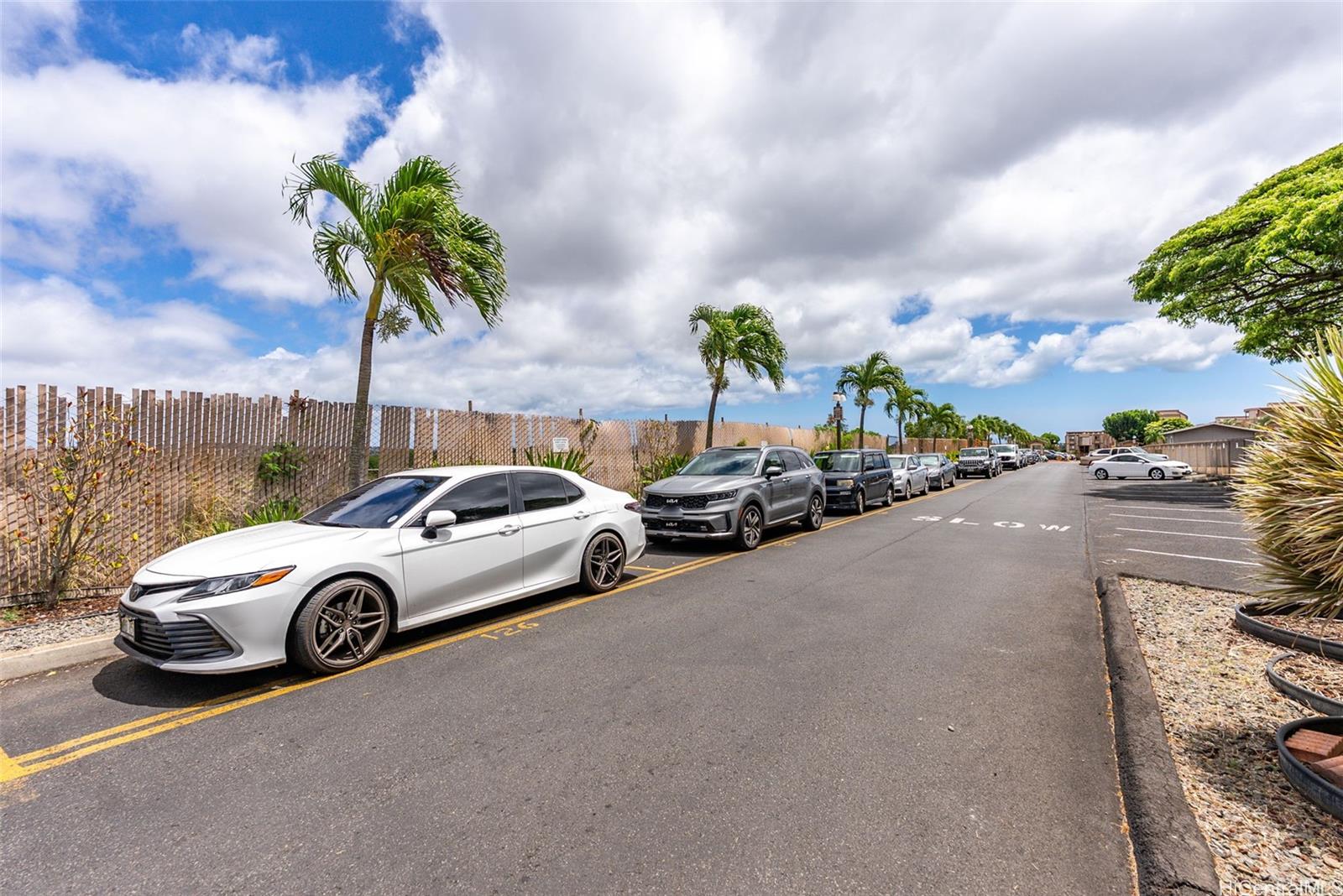 98-941 Moanalua Road, Unit 402 Aiea, HI 96701 - Photo 20 of 22 a car parked in front of a house
