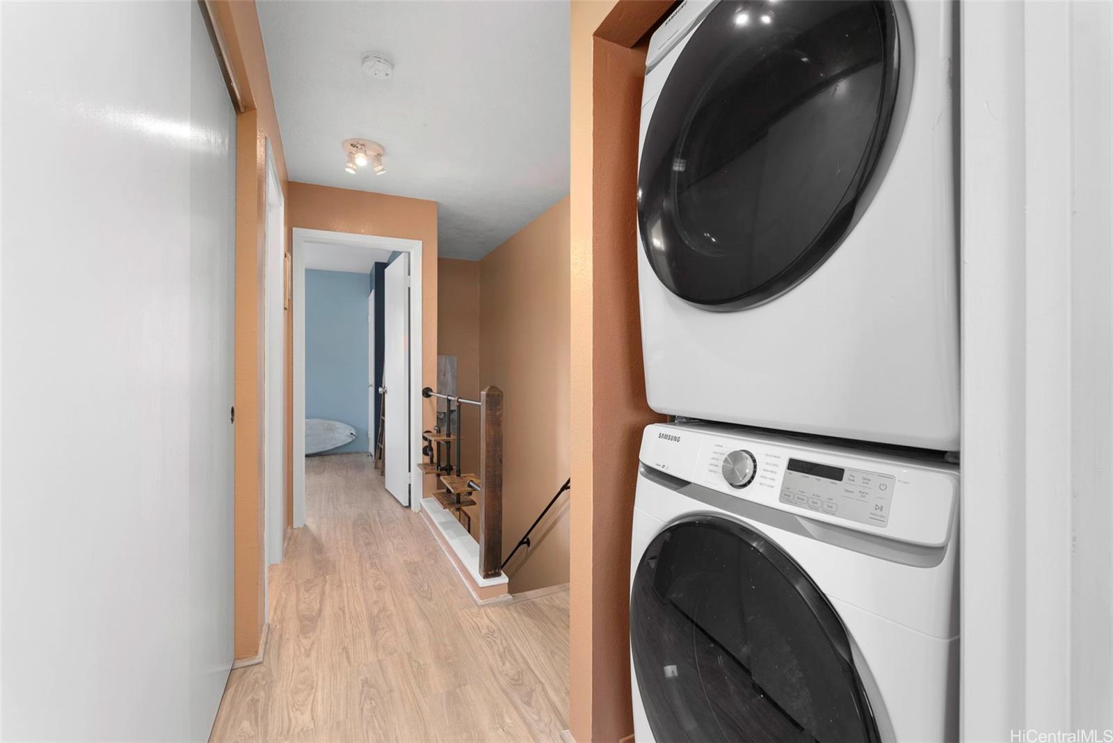 98-941 Moanalua Road, Unit 402 Aiea, HI 96701 - Photo 10 of 22 a view of a hallway with washer and dryer