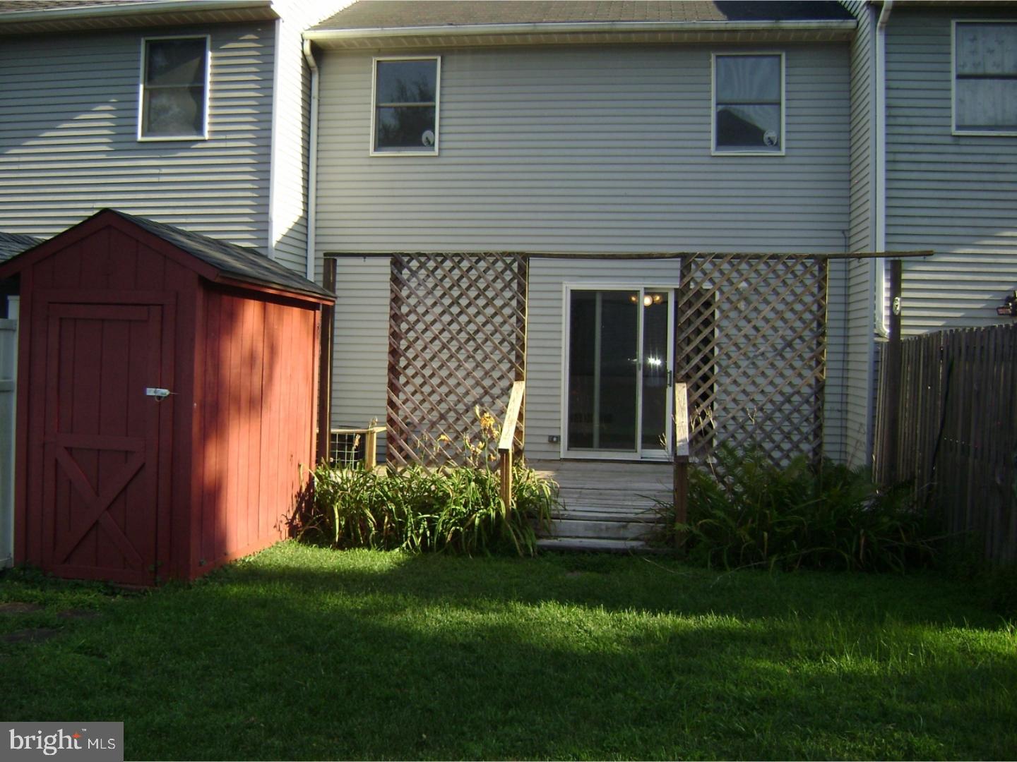 3314 Roxbury Road Hatfield, PA 19440 - Photo 2 of 26 a view of a house with brick walls and a yard with plants
